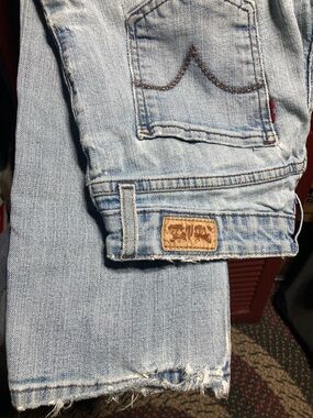 Light Wash Vintage Levi Jeans with Distressed Hem